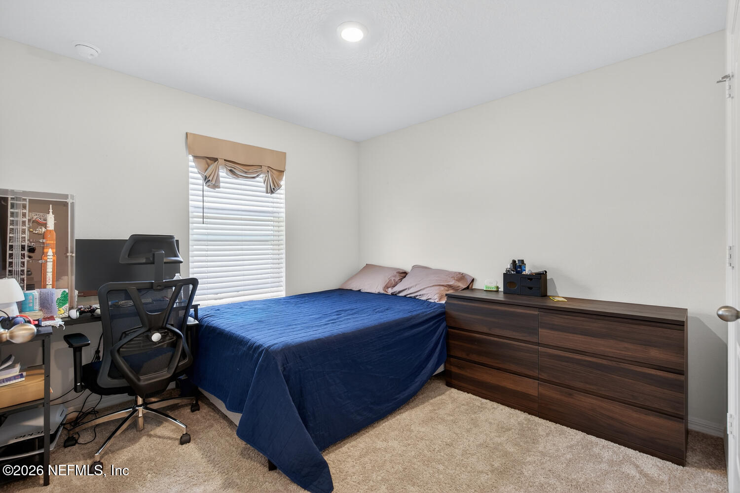 2 Radium Lane Palm Coast, FL 32164 - Photo 15 of 22 a bedroom with a bed and a window