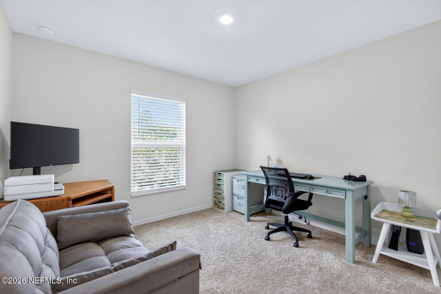 2 Radium Lane Palm Coast, FL 32164 - Photo 17 of 22 a livingroom with workspace and a window