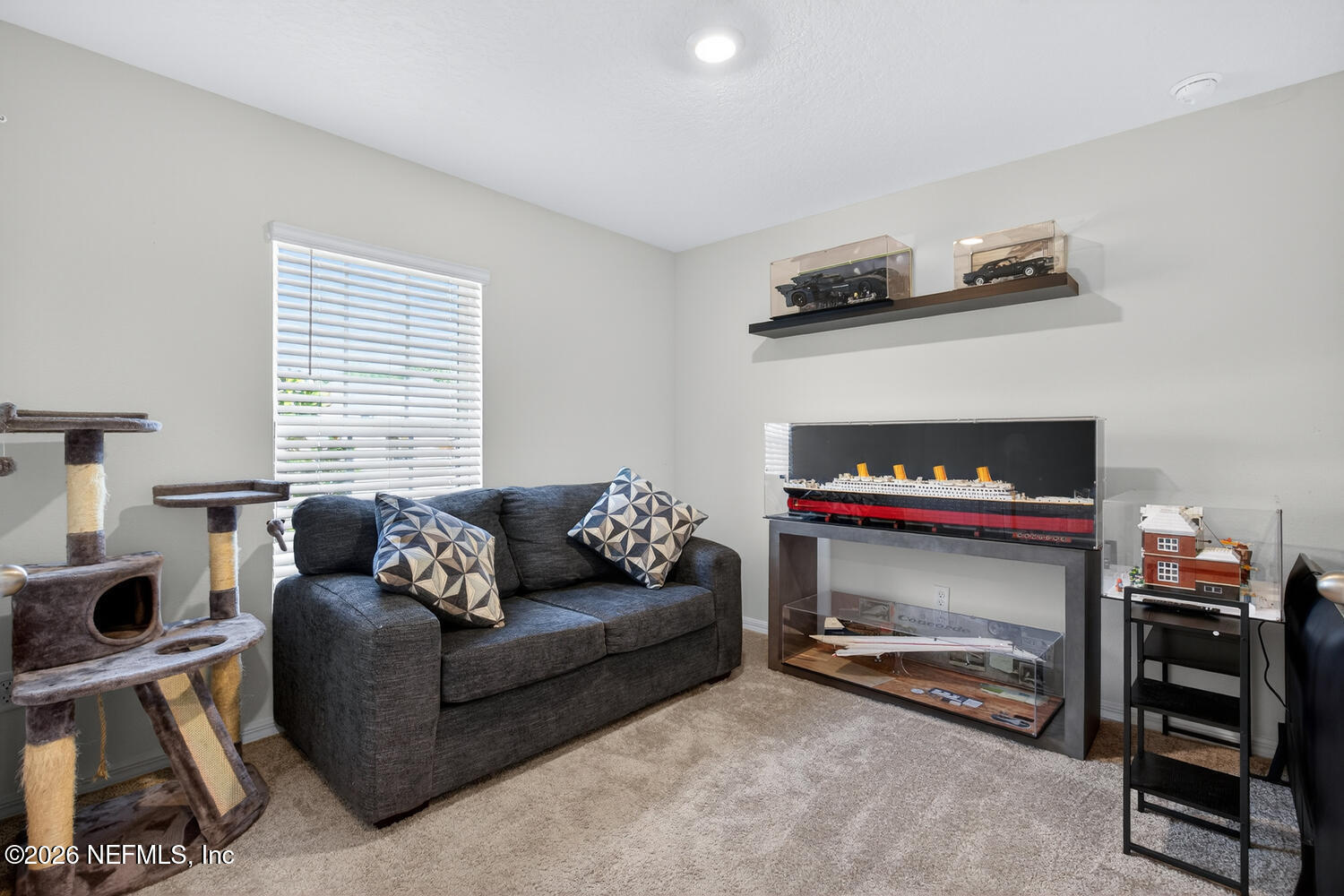 2 Radium Lane Palm Coast, FL 32164 - Photo 18 of 22 a living room with furniture and a fireplace