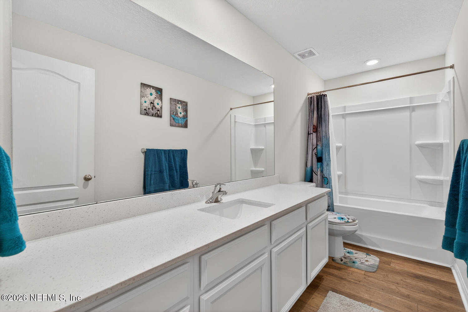2 Radium Lane Palm Coast, FL 32164 - Photo 19 of 22 a bathroom with a double vanity sink toilet mirror and bathtub