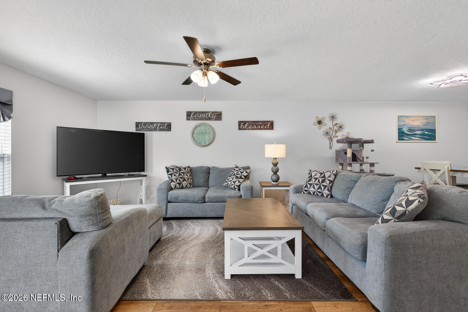 2 Radium Lane Palm Coast, FL 32164 - Photo 3 of 22 a living room with furniture and a flat screen tv