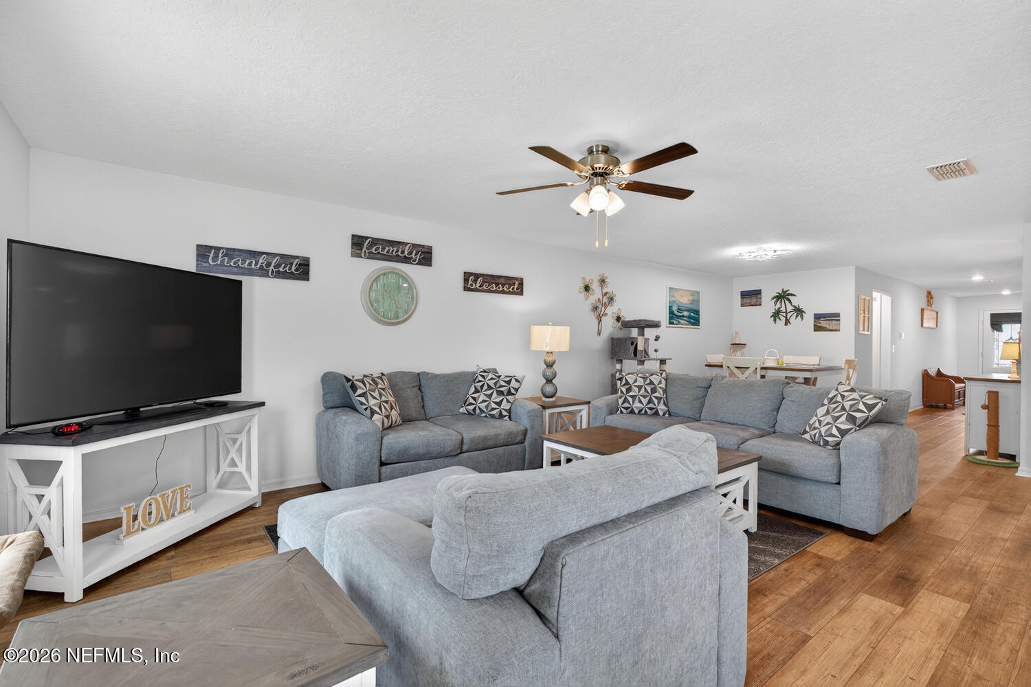 2 Radium Lane Palm Coast, FL 32164 - Photo 4 of 22 a living room with furniture and a flat screen tv