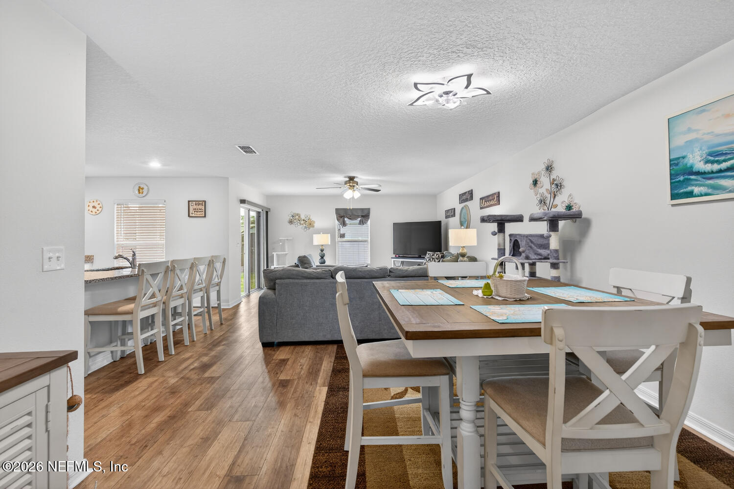 2 Radium Lane Palm Coast, FL 32164 - Photo 6 of 22 a view of a dining room with furniture and wooden floor