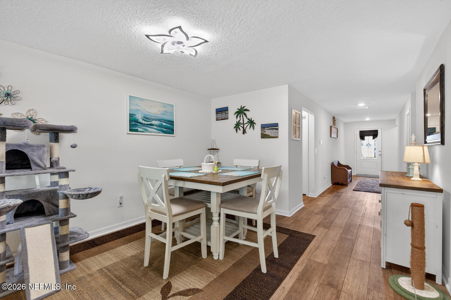 2 Radium Lane Palm Coast, FL 32164 - Photo 7 of 22 a view of a dining room with furniture and a chandelier