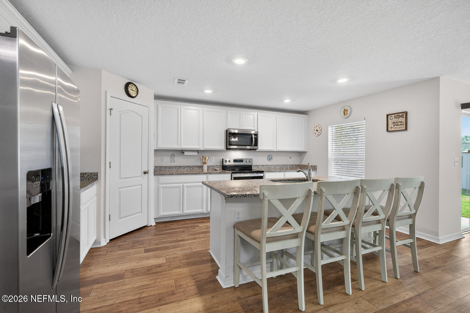 2 Radium Lane Palm Coast, FL 32164 - Photo 8 of 22 a kitchen with stainless steel appliances granite countertop a refrigerator and a stove top oven