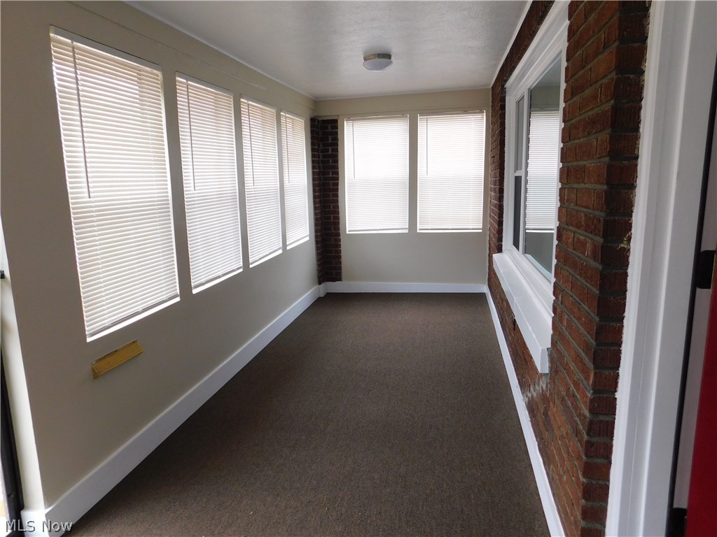 1227 Copley Road Akron, OH 44320 - Photo 16 of 35 Enclosed front porch perfect for extra living space, new carpet