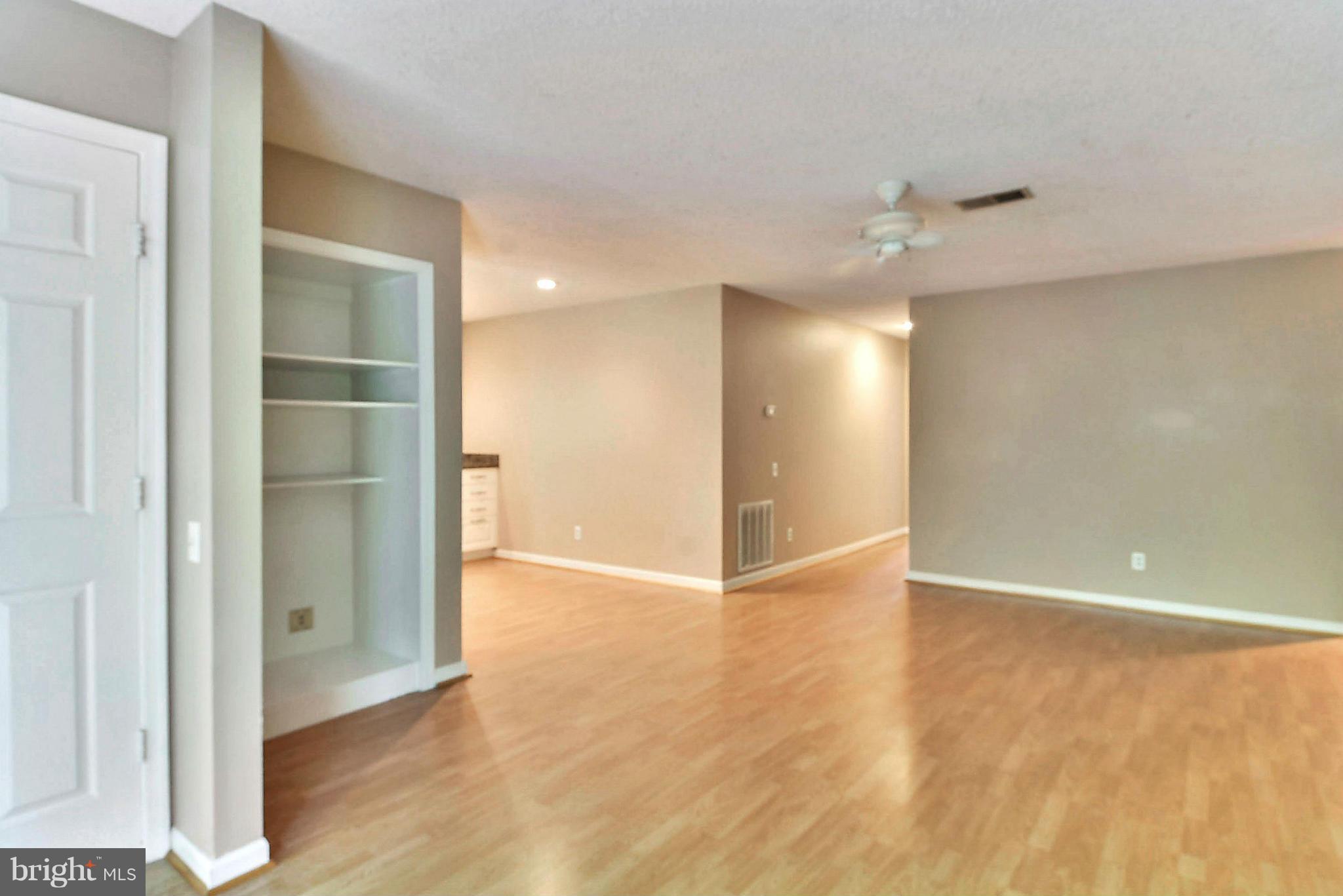 12010 Golf Ridge Court, Unit 102 Fairfax, VA 22033 - Photo 6 of 29 Spacious Living Room w/built-in shelving.