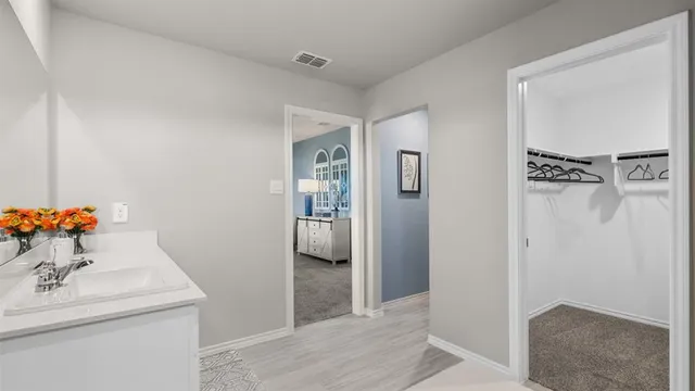 a bathroom with a sink double vanity and shower