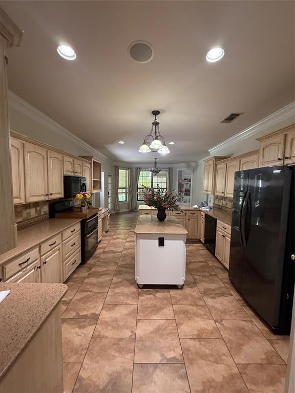 201 Woodhaven Drive Minden, LA 71055 - Photo 8 of 31 Spacious kitchen featuring extensive cabinetry, stone-finish countertops, tile flooring, and recessed lighting