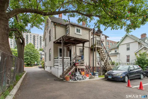 a view of a car park in front of house
