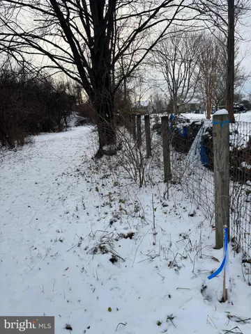 a view of snow on the road