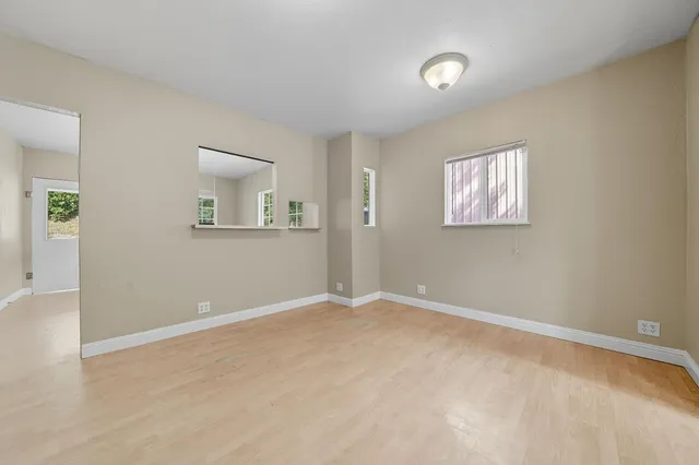 a view of an empty room with a window