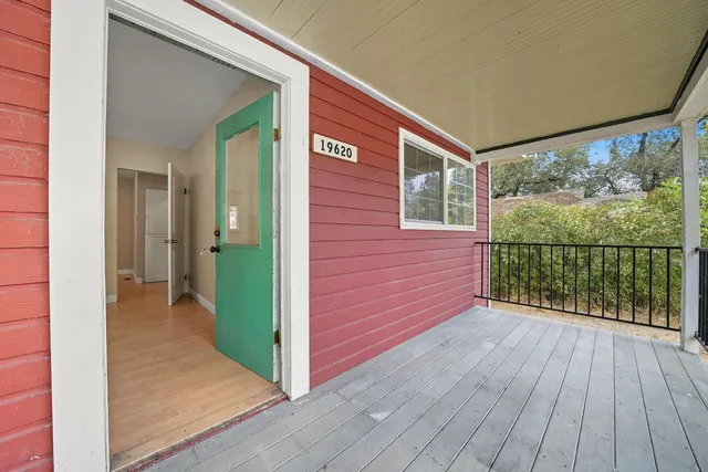 a view of a balcony with wooden floor