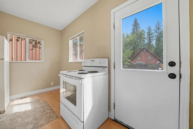 a view of a hallway with washer and dryer