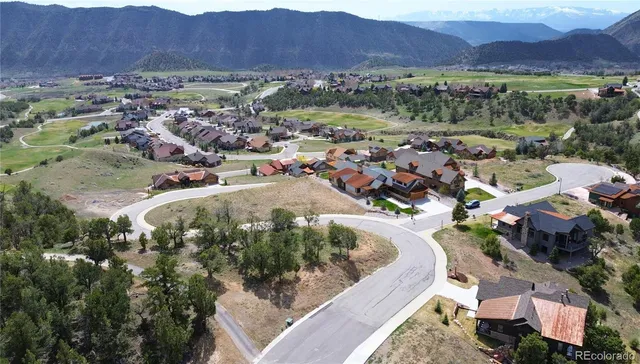an aerial view of a house with outdoor space