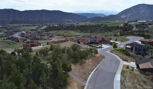 an aerial view of residential house with outdoor space
