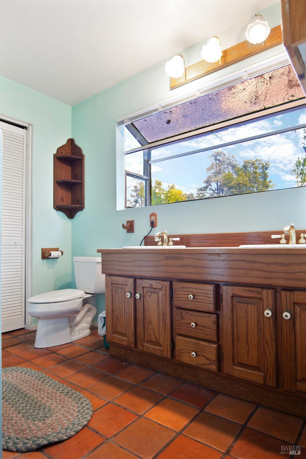 700 Cecelia Drive Glen Ellen, CA 95442 - Photo 11 of 13 a bathroom with a sink and a mirror