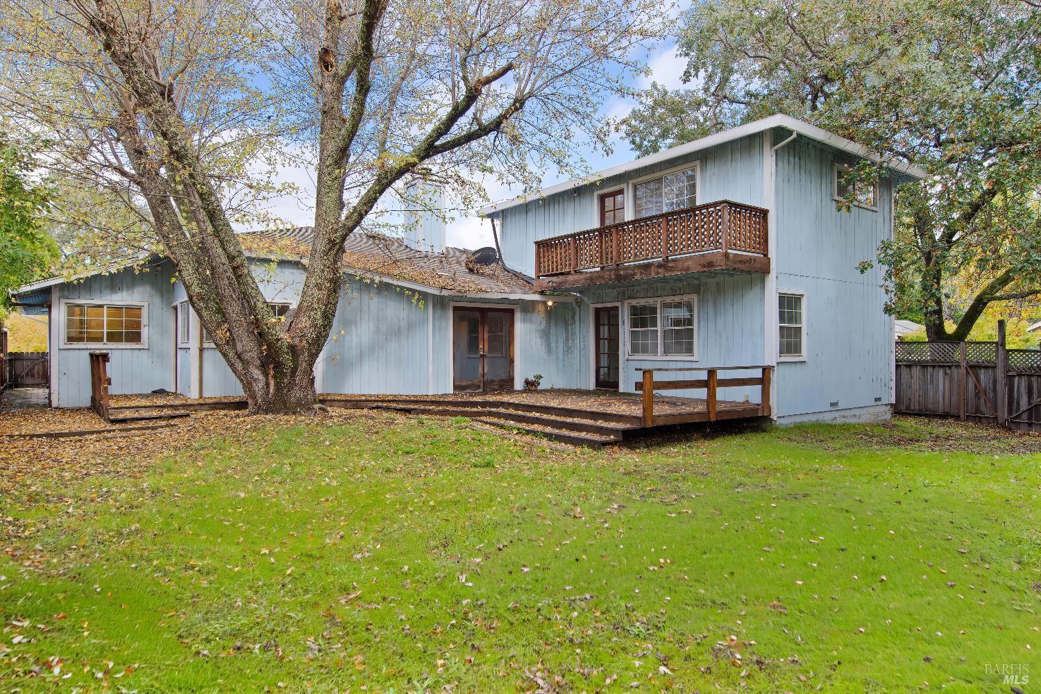 700 Cecelia Drive Glen Ellen, CA 95442 - Photo 2 of 13 a view of a house with a yard and large tree