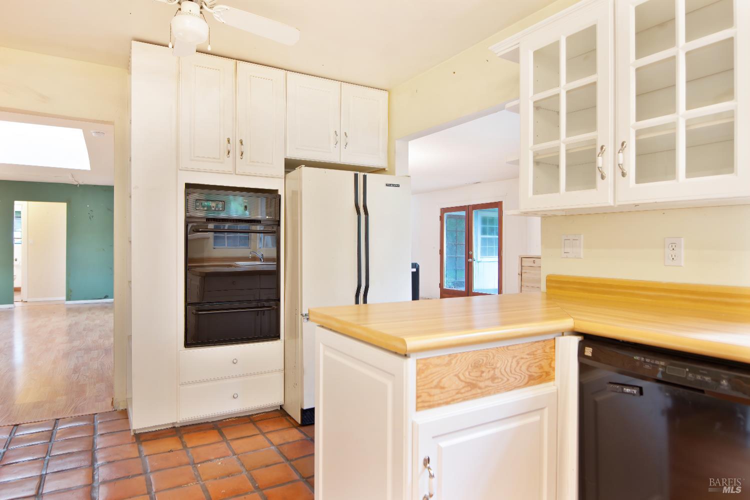 700 Cecelia Drive Glen Ellen, CA 95442 - Photo 5 of 13 a kitchen with a sink and a refrigerator