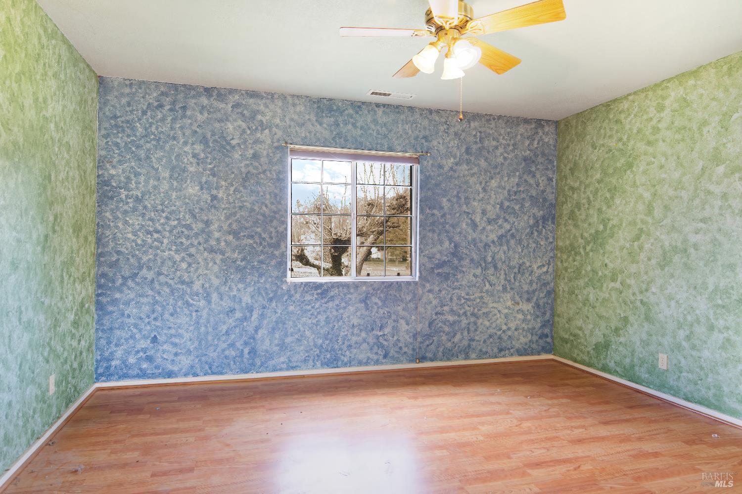 700 Cecelia Drive Glen Ellen, CA 95442 - Photo 8 of 13 a view of an empty room with wooden floor and a window