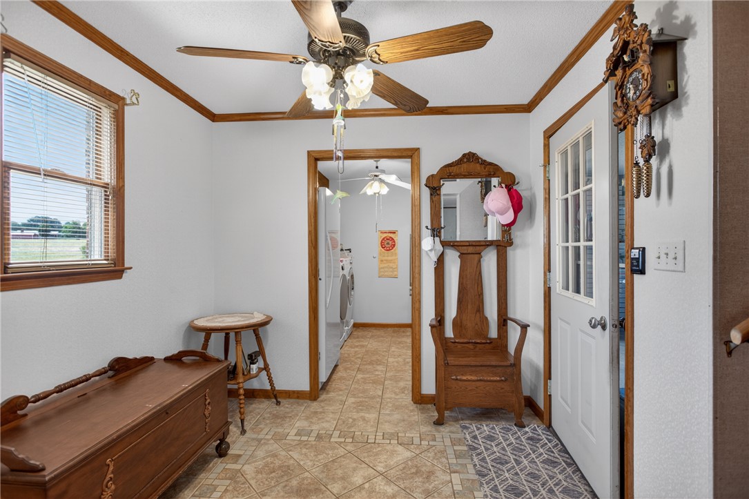 145 State Rd S-4-935 Pendleton, SC 29670 - Photo 39 of 47 A well-lit entry area featuring a ceiling fan and practical tile flooring.