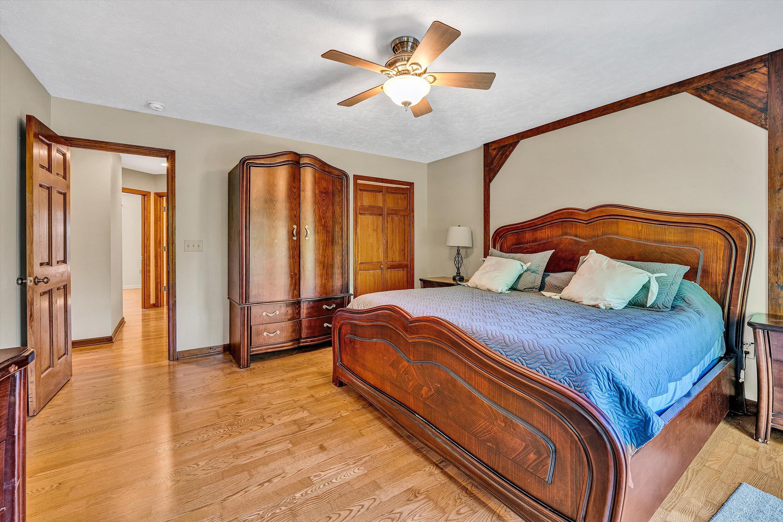 400 Harbor Moneta, VA 24121 - Photo 20 of 51 a bedroom with a large bed and a chandelier