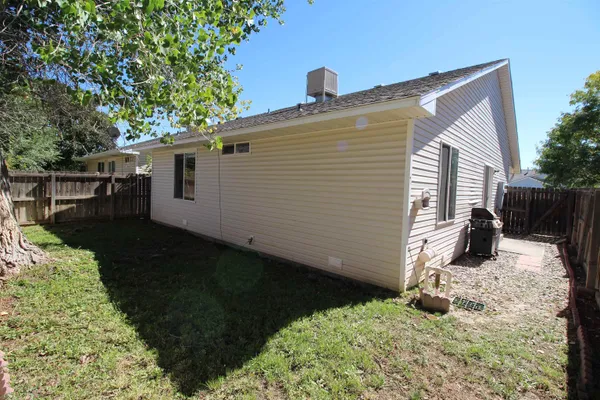 a view of a house with a yard