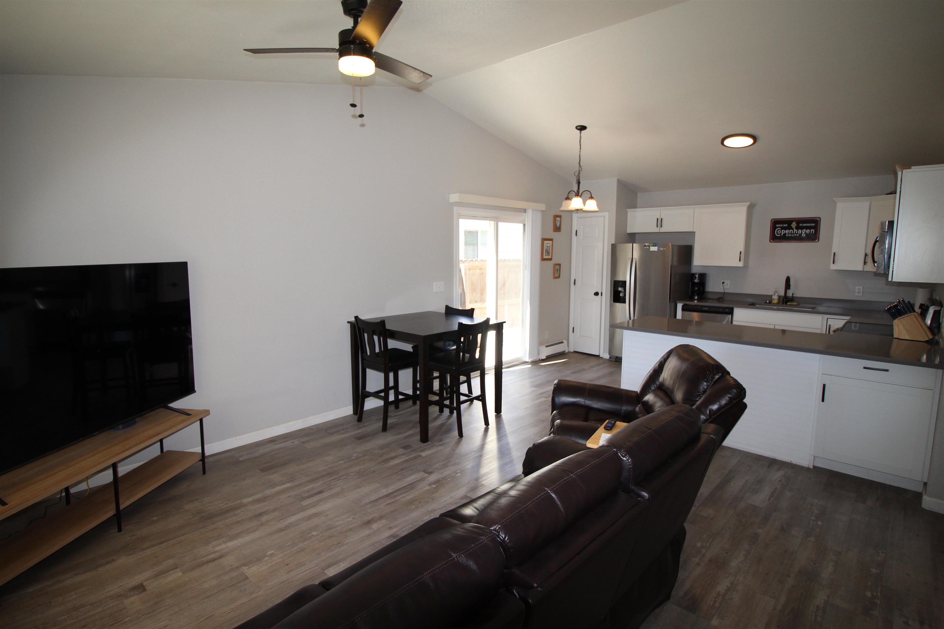 656 Laredo Court, Unit A Grand Junction, CO 81505 - Photo 3 of 13 a living room with furniture and a flat screen tv