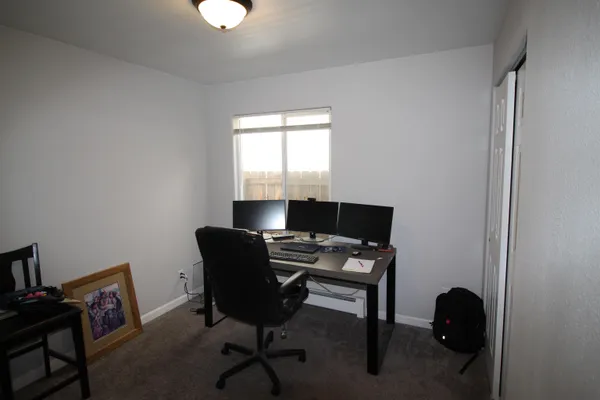 a workspace with furniture and a window