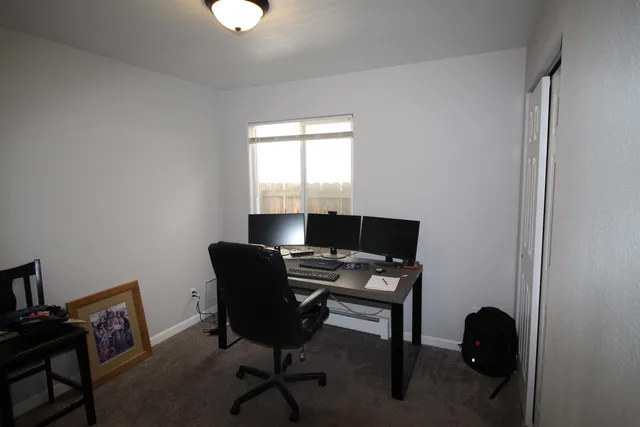 a workspace with furniture and a window