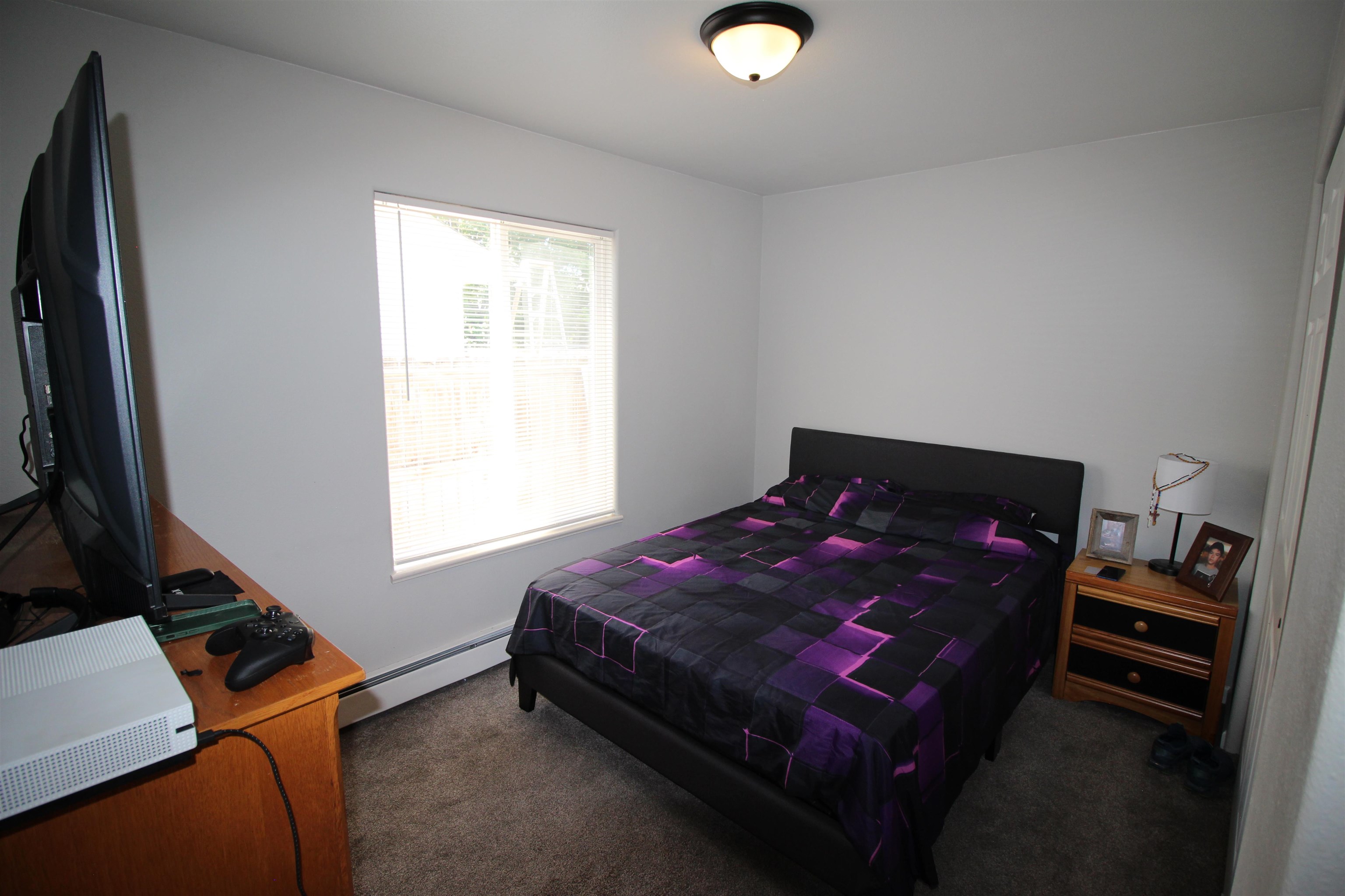 656 Laredo Court, Unit A Grand Junction, CO 81505 - Photo 9 of 13 a bedroom with a bed and a window