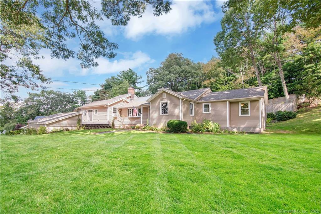 50 Doyle Road Tolland, CT 06084 - Photo 1 of 1 a front view of a house with a garden