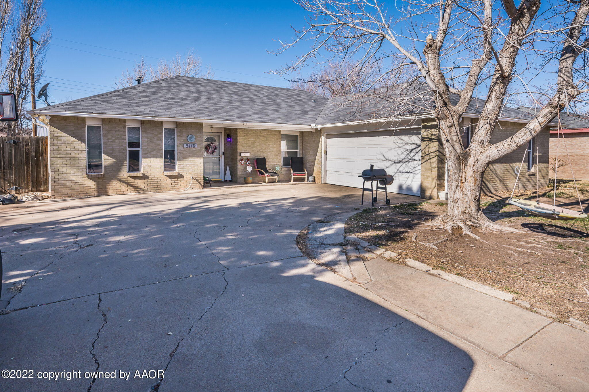 a front view of a house with sitting area