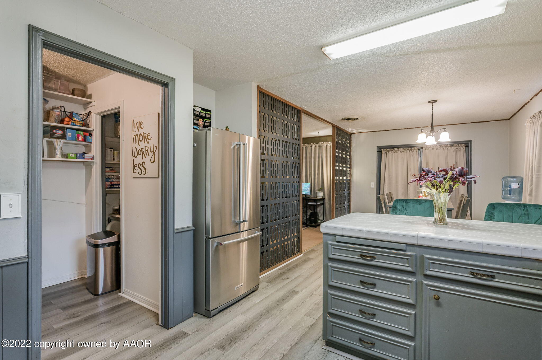 5110 Shawnee Trail Amarillo, TX 79109 - Photo 11 of 22 a kitchen with refrigerator and cabinets