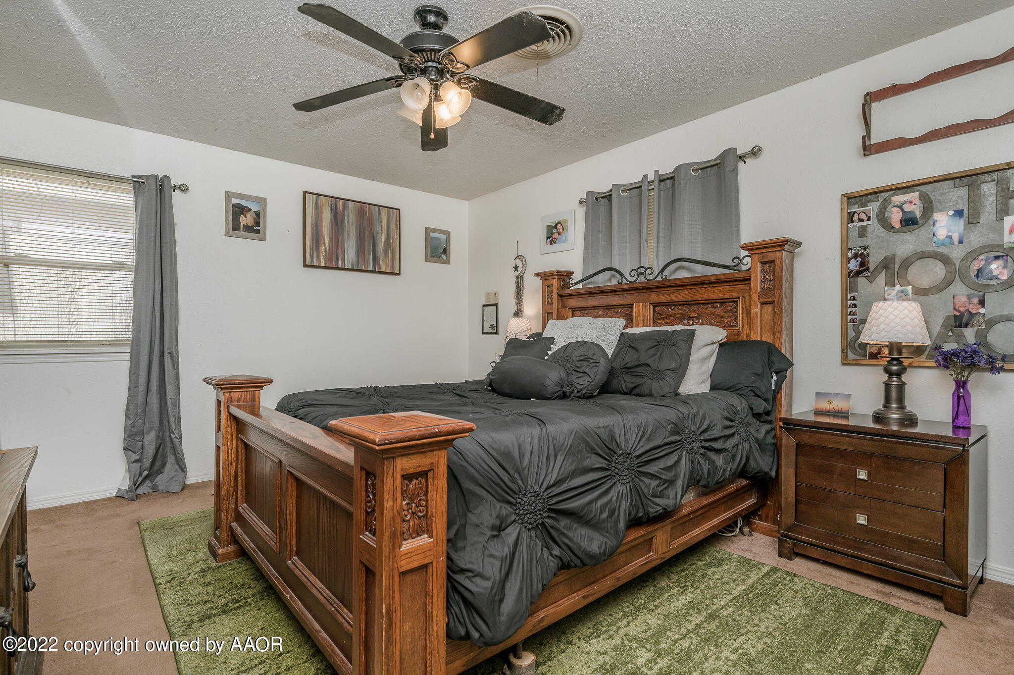 5110 Shawnee Trail Amarillo, TX 79109 - Photo 12 of 22 a bed room with a bed and a chandelier