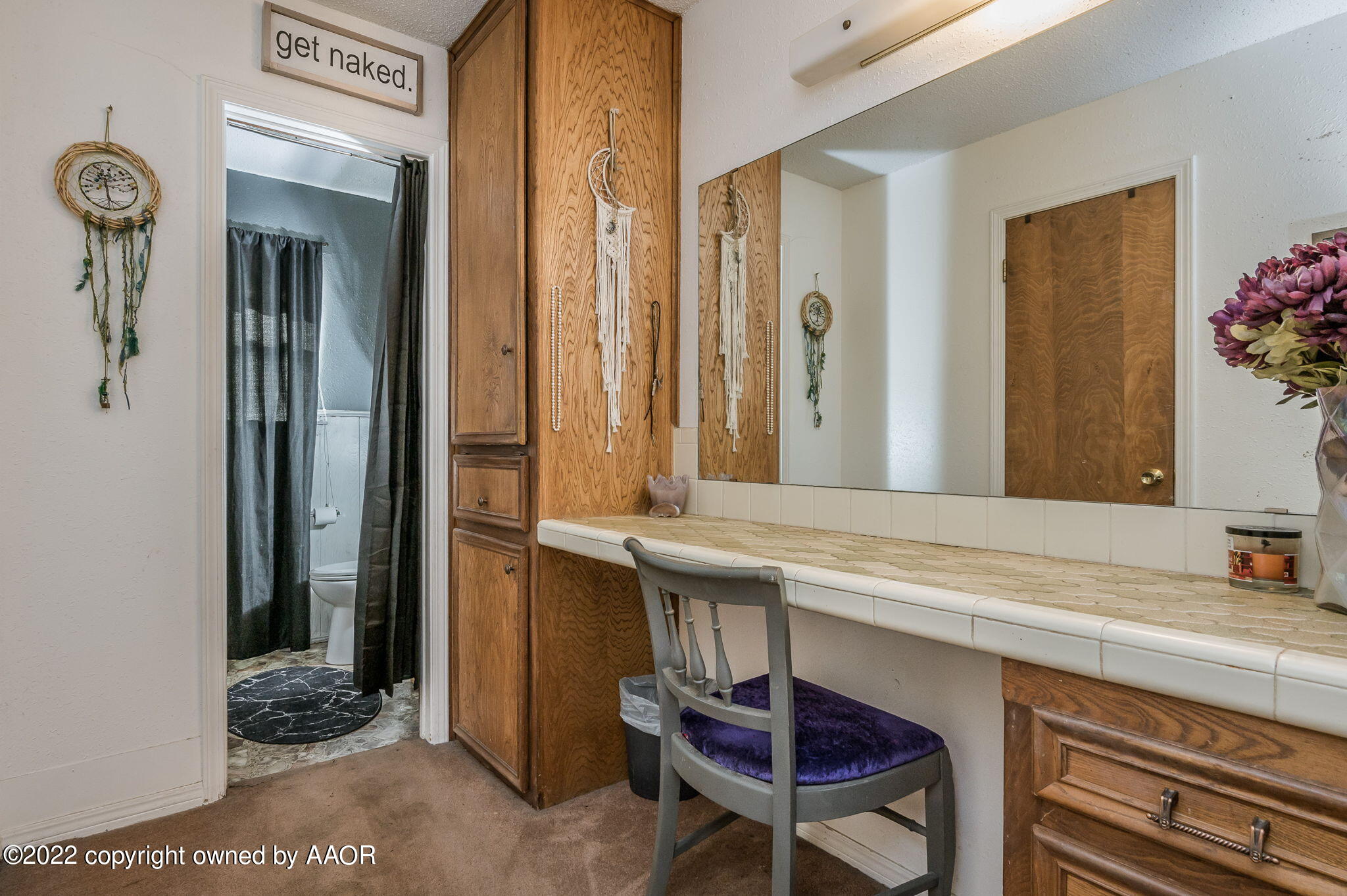 5110 Shawnee Trail Amarillo, TX 79109 - Photo 14 of 22 a bathroom with a sink and a mirror