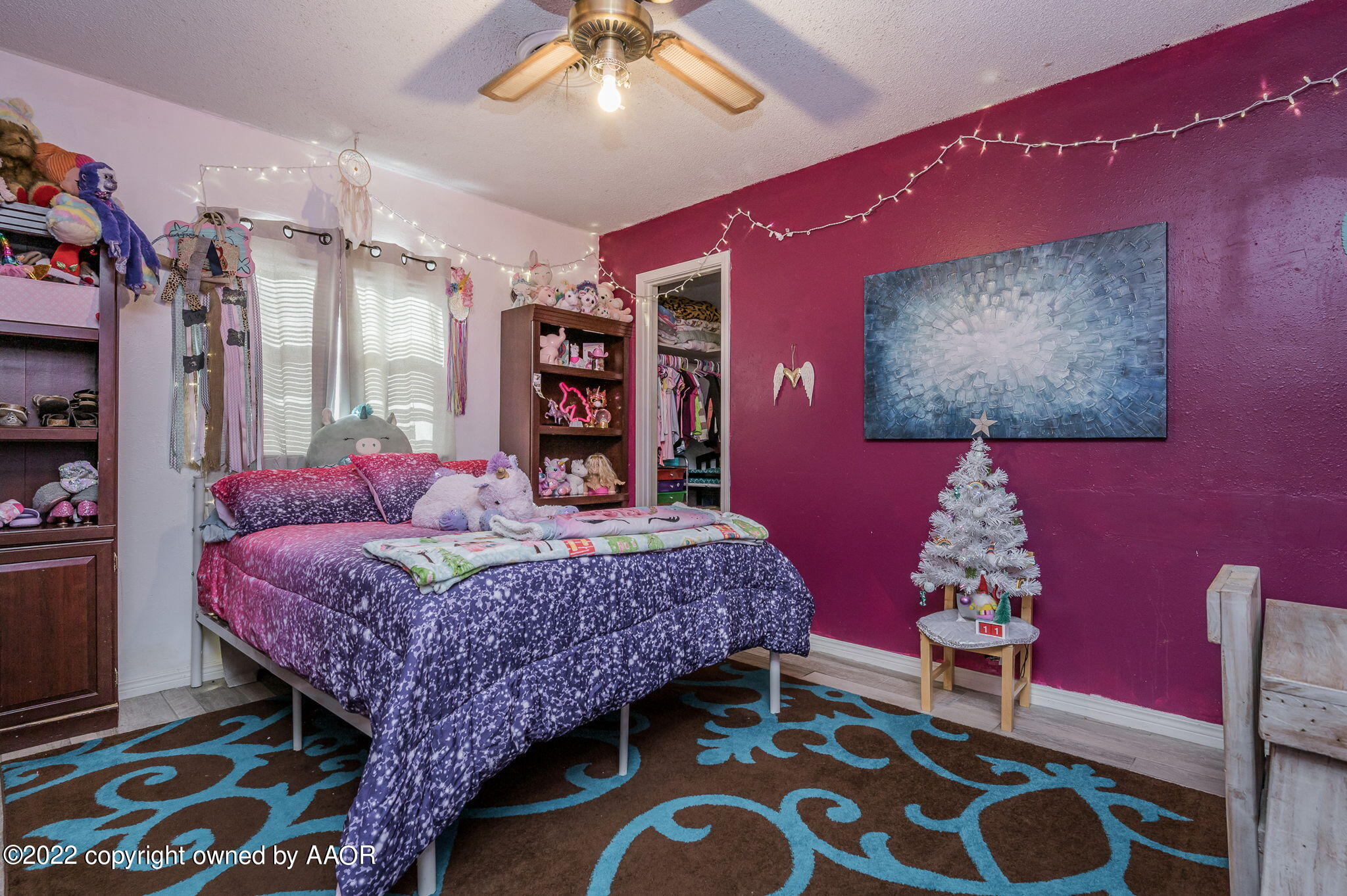 5110 Shawnee Trail Amarillo, TX 79109 - Photo 17 of 22 a bedroom with a bed and a lamp