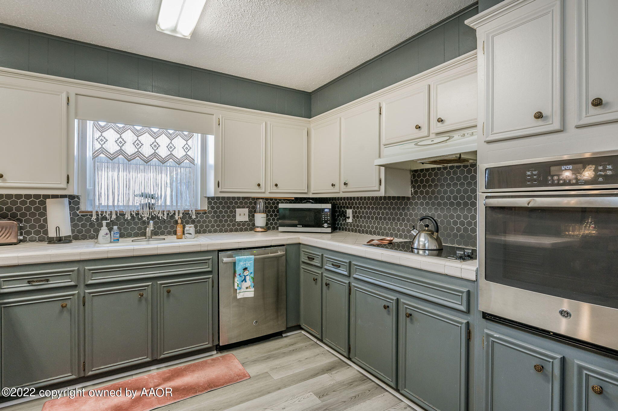 5110 Shawnee Trail Amarillo, TX 79109 - Photo 10 of 22 a kitchen with cabinets appliances a sink and a window
