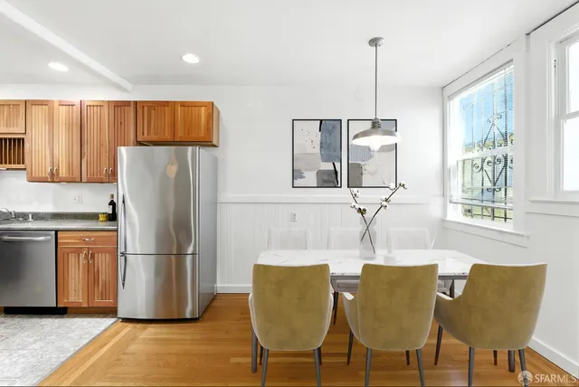 a view of a room with wooden floor and window