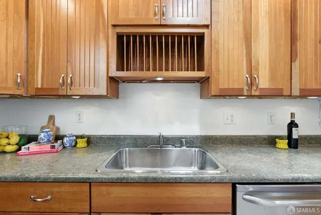 a kitchen with granite countertop a stove and a microwave