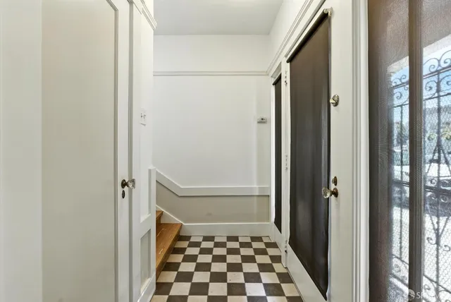 a view of a patio with couches table and chairs and potted plants
