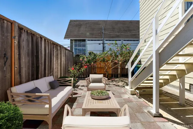 an aerial view of residential building with parking