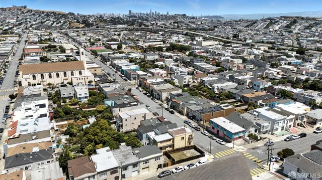 a front view of a building with a parking space