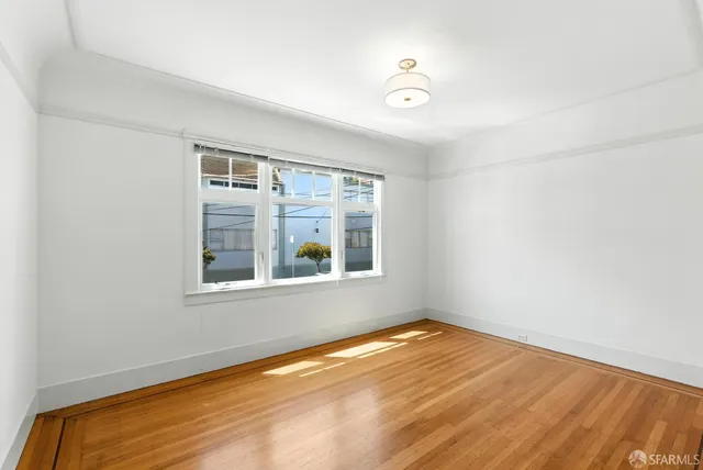 a view of a hallway with bathroom and bathroom