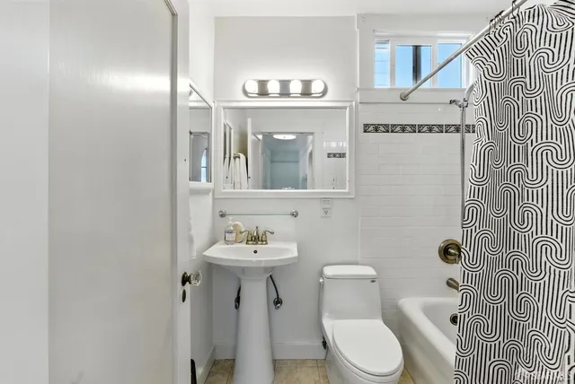 a kitchen with kitchen island a counter top space wooden floor and stainless steel appliances