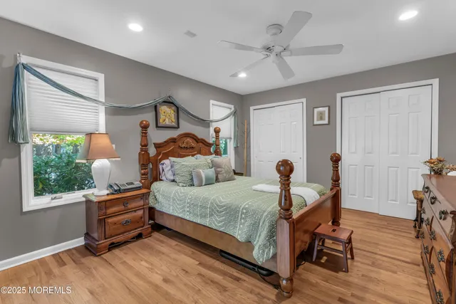 a view of a hallway to a livingroom with furniture