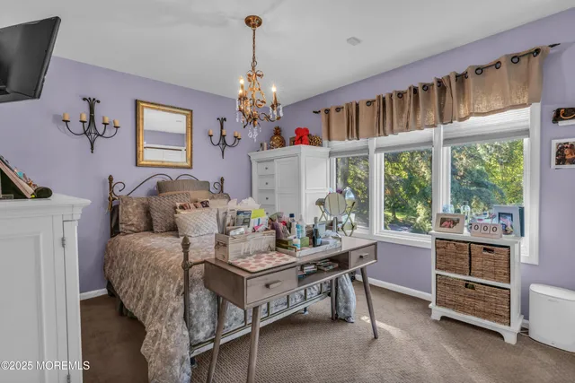 a bedroom with a bed and a table