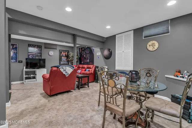 a front view of a house with swimming pool table and chairs