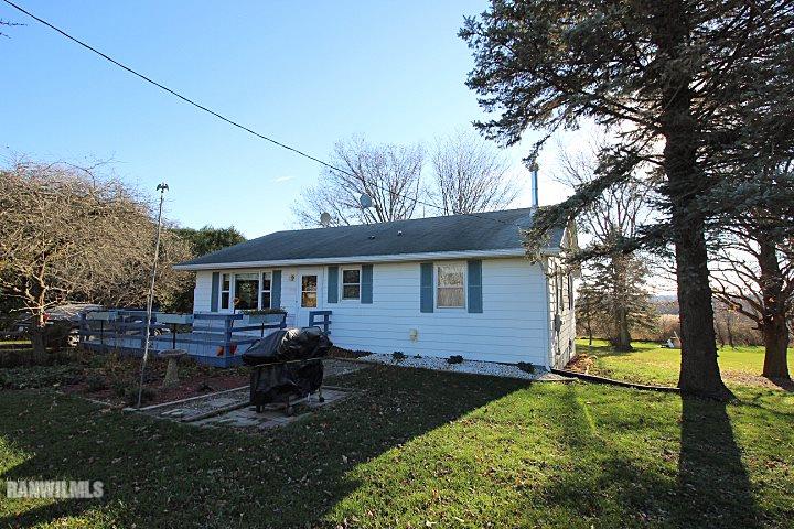 7559 West Dublin Road Freeport, IL 61032 - Photo 1 of 22 a front view of a house with yard and trees