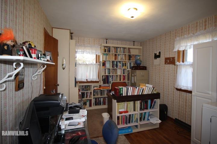 7559 West Dublin Road Freeport, IL 61032 - Photo 12 of 22 a view of a livingroom with furniture and book shelf